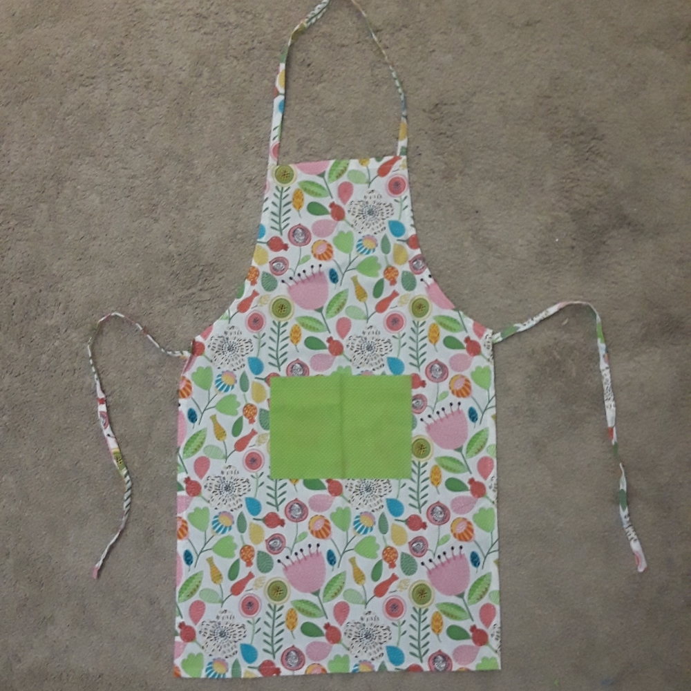 Apron, whimsical flower pattern, never been used
